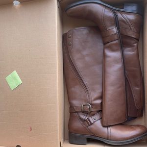 Tall brown sketcher boots